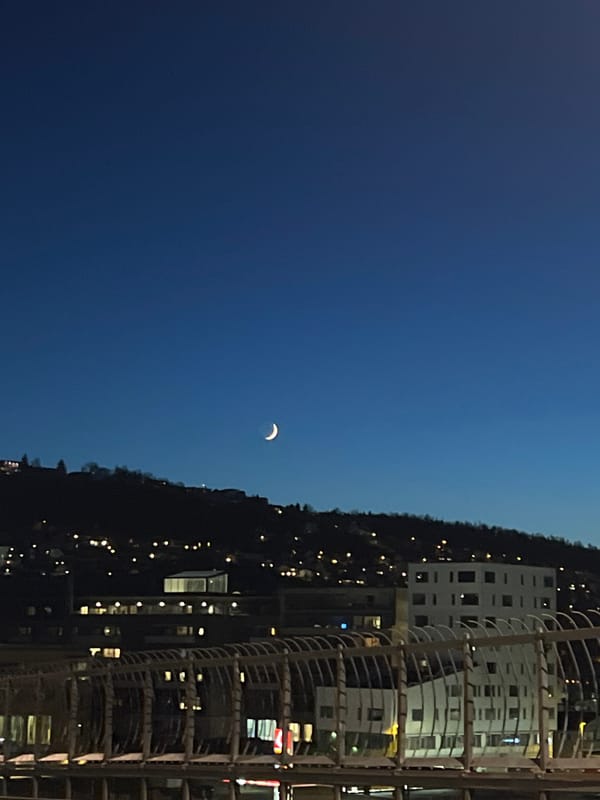 Crescent moon observed in evening sky over Tromsø, Norway
