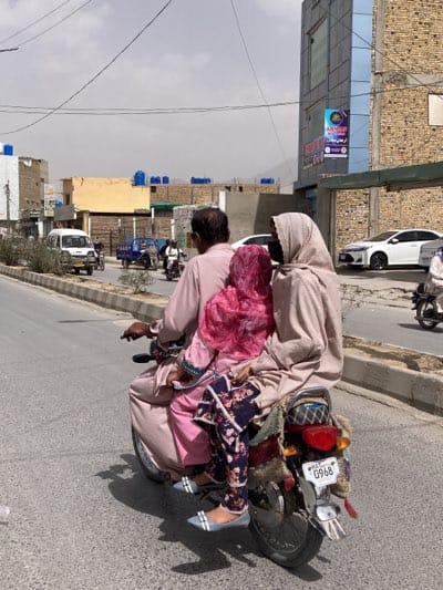 Children share rides on motorcycle, bicycle in Quetta streets