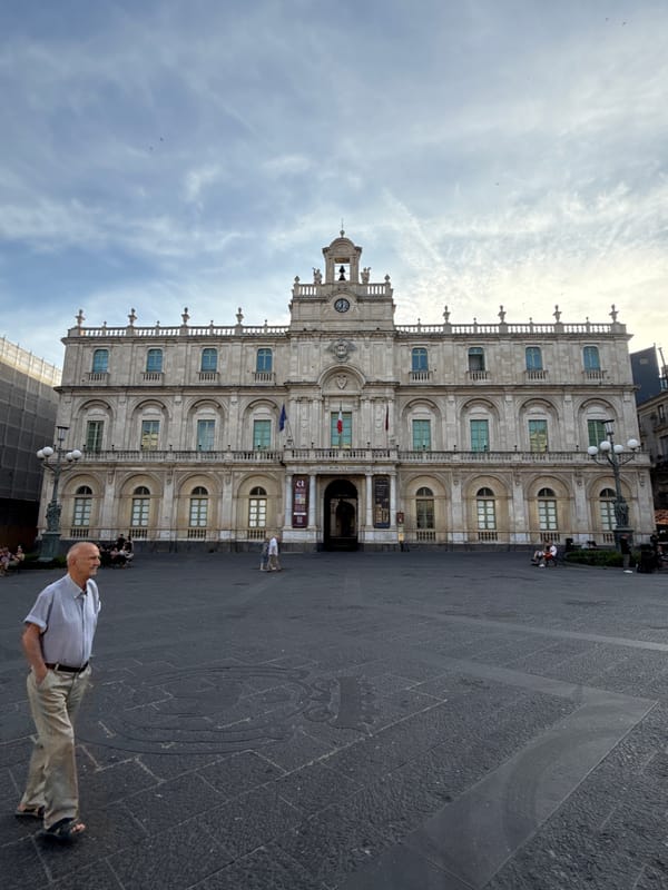 Tourist documents historic Catania landmarks and street life