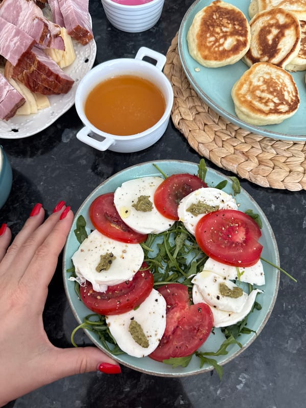 Brunch spread and a small dog at a Sochi home