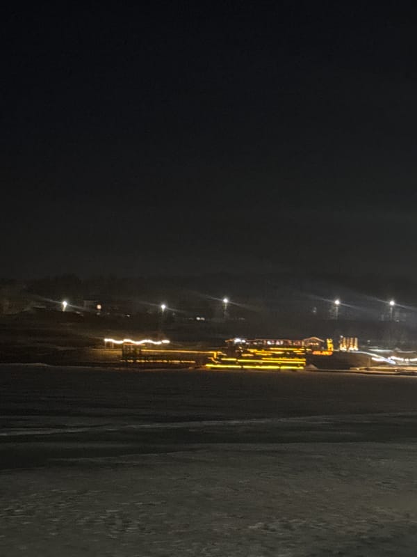 Illuminated pier glows with yellow lights in Votkinsk Russia
