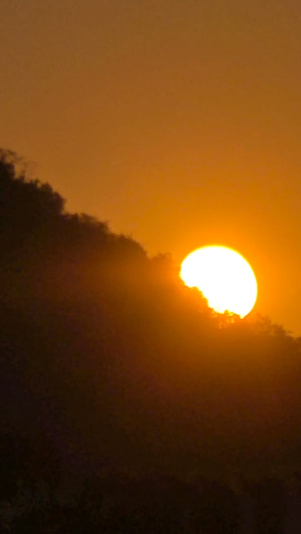 Hazy orange sunset observed at Vietnamese heritage area