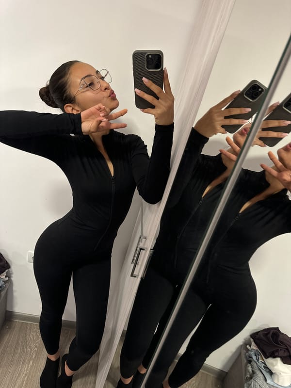 Woman Takes Mirror Selfies in Black Jumpsuit, Dupnitsa