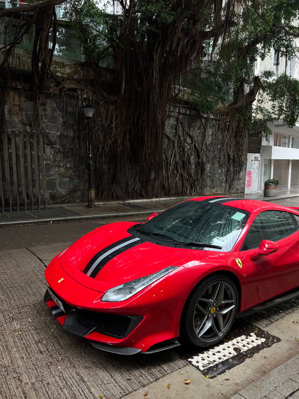 Red Ferrari spotted on wet Hong Kong street