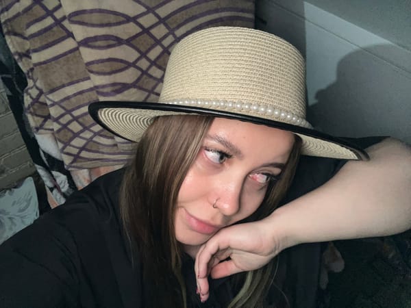 Evening photo session captures woman, flowers, kitten in Novopokrovskaya