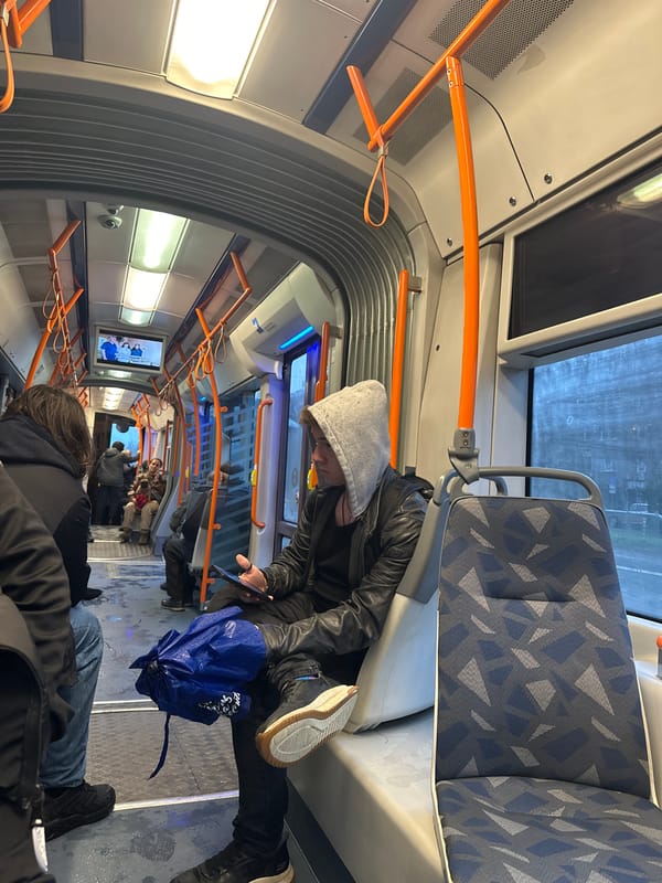 Person rests on public transport seats in Sofia