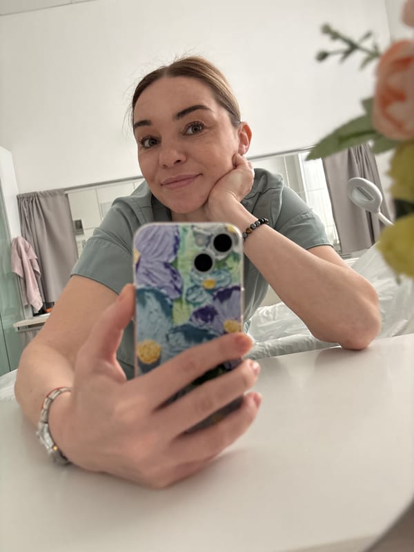 Woman takes mirror selfie in uniform, Romanovka Russia