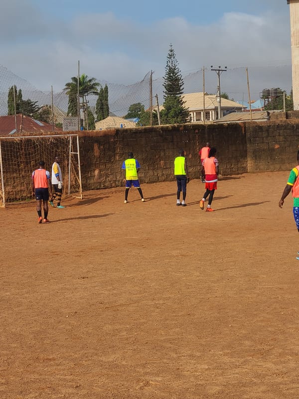 Football training session on a dirt pitch in Barakin Lerawi, Nigeria