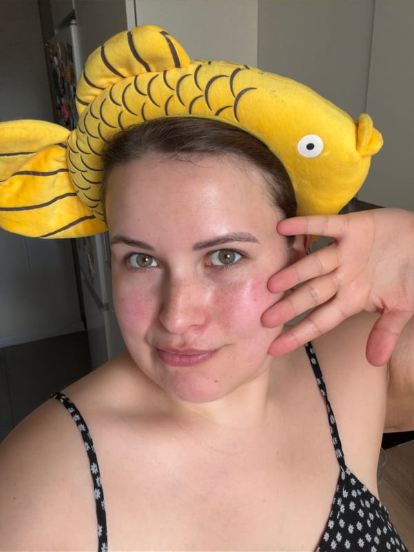 Woman in fish hat spotted indoors in Riga