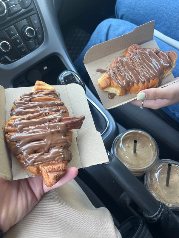Travelers Share Chocolate Croissants in Car in Dabnitsa, Bulgaria