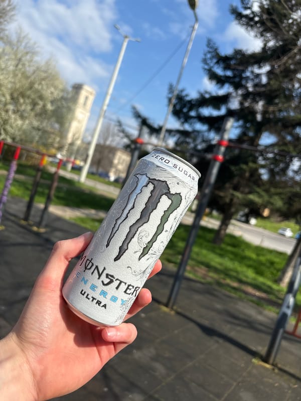 Person holds energy drink outdoors in Ruse, Bulgaria