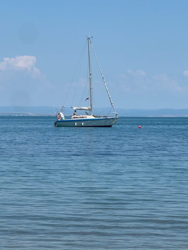 Sailboat anchored off Sozopol, hermit crabs in a bucket on deck