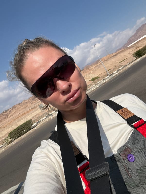 Tourist takes selfie in climbing gear in Dahab, Egypt