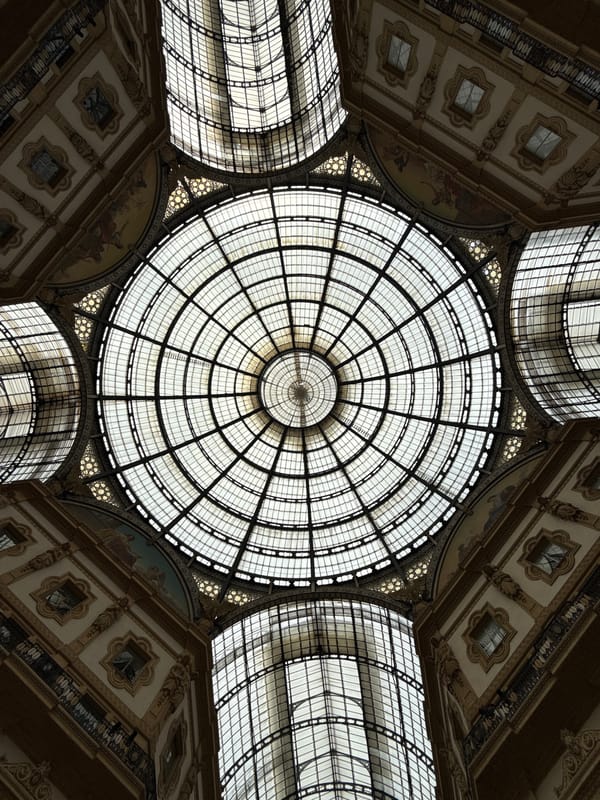 Typical tourist activity documented at Milan's Galleria Vittorio Emanuele II