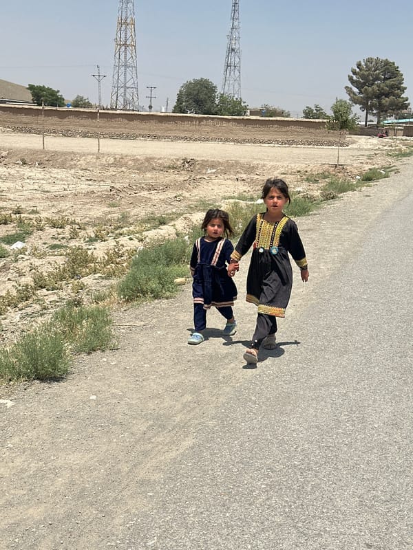 Daily life documented in Kanozai: children walking, junkyard scenes