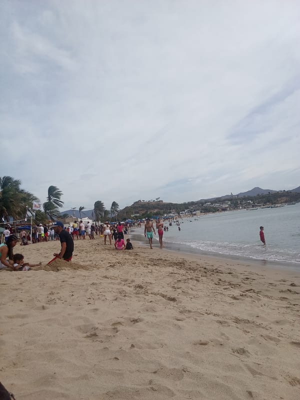 Crowded beach gathering captured in Juan Griego, Venezuela