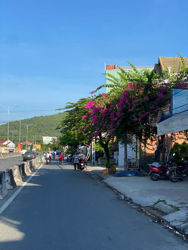 Street-level scenes through a busy Southeast Asian city district