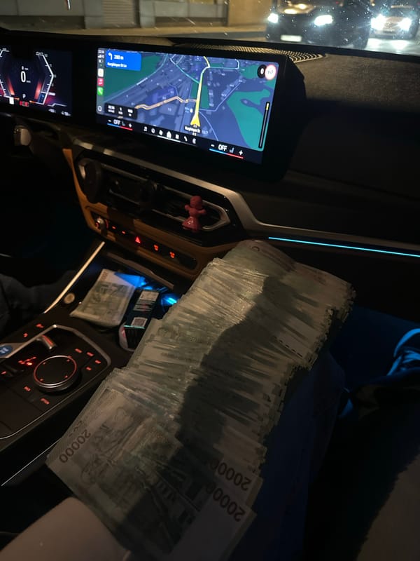 Stack of Armenian Dram banknotes observed in car interior