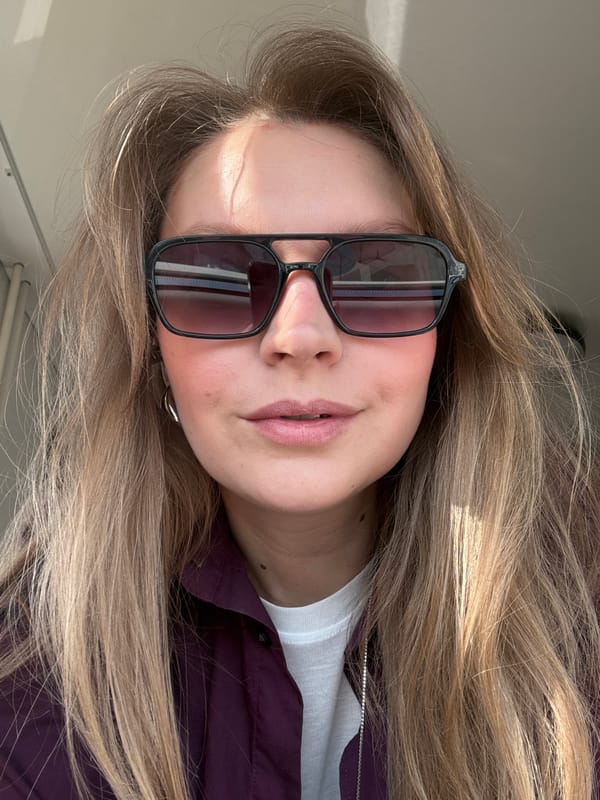 Woman photographed in sunglasses and purple jacket in Izhevsk