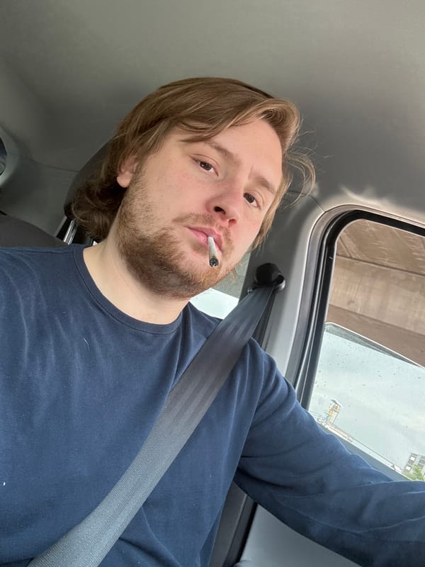 Man takes selfie while smoking in vehicle