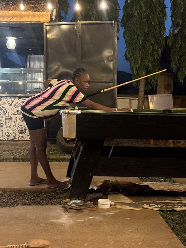 Evening billiards game at outdoor salon in Dutsen Alhaji