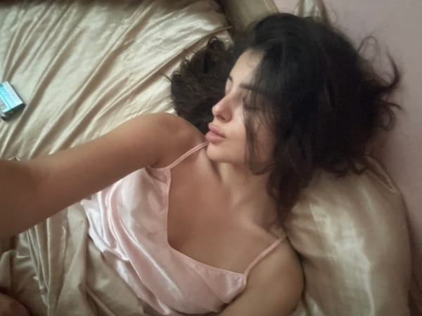 Quiet bedroom moment in Plovdiv with satin bedding