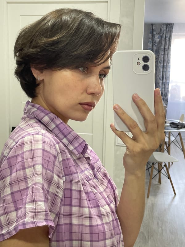 Woman takes early morning selfies in Izhevsk bedroom