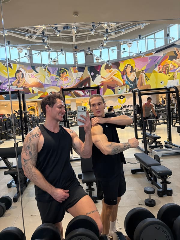 Two men take gym selfie in Moscow fitness center