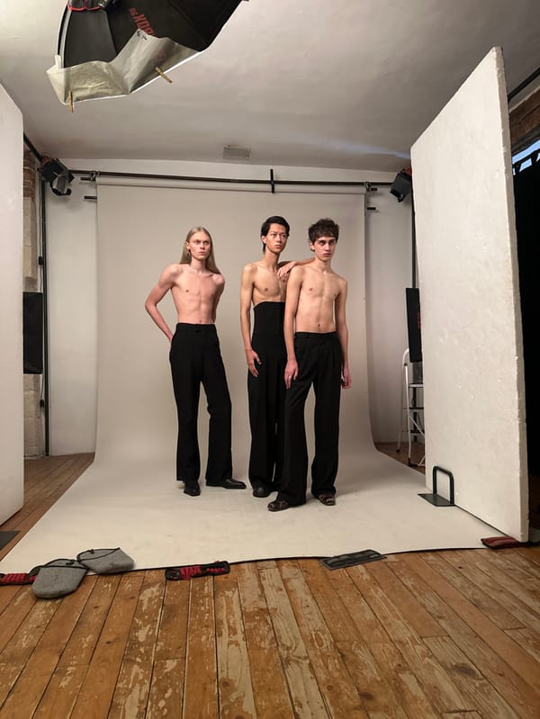 Three men pose stacked in Paris studio photoshoot