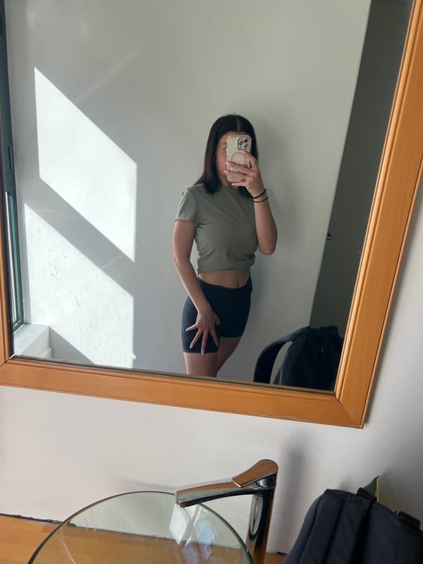 Woman takes morning selfies at modern gym facility