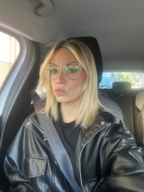 Woman in black leather jacket observed in parked car, Vallauris