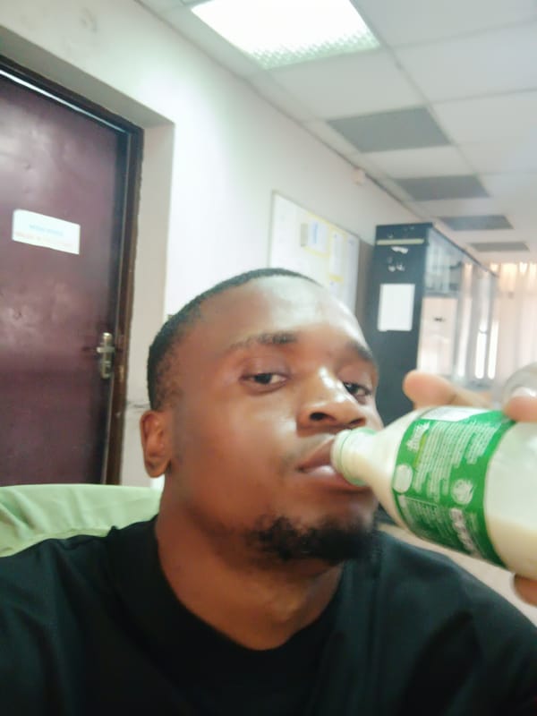 Man photographed drinking, taking selfies in Nigerian office spaces