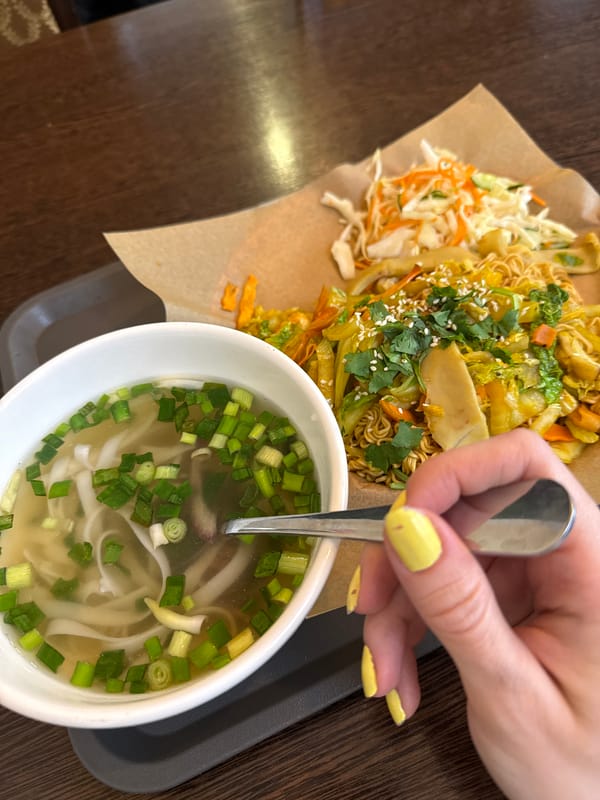 Person enjoys Vietnamese pho soup in Moscow