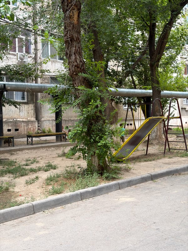 Morning walkthrough of a Shymkent residential courtyard and its streets