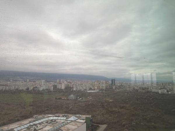 Sofia cityscape photographed from elevated viewpoint under overcast skies