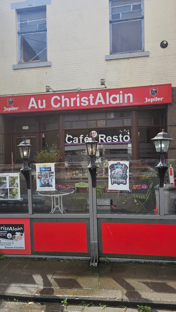 Morning street documentation in Thuin shows cafe, historic buildings