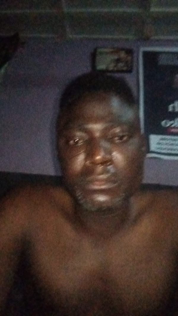 Man photographed in residential setting in Sabon Tasha, Nigeria
