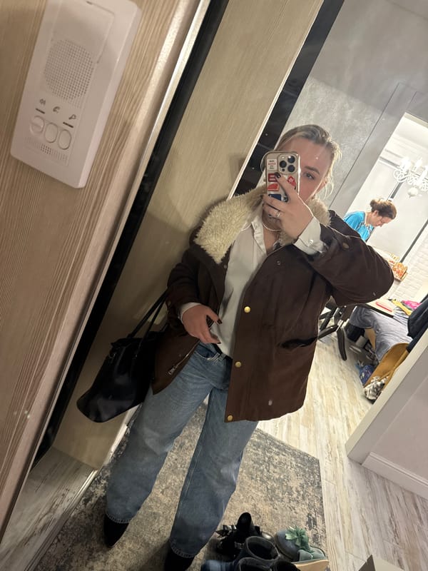 Woman takes mirror selfie in Chaikovsky, Russia