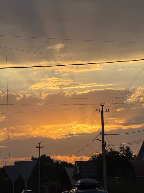 Golden sunset sweeps across Talas City streets and skyline