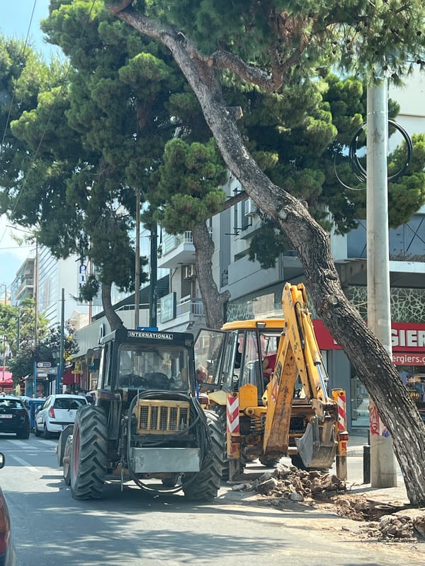 Street excavation and bougainvillea gate in Kallithea, Greece