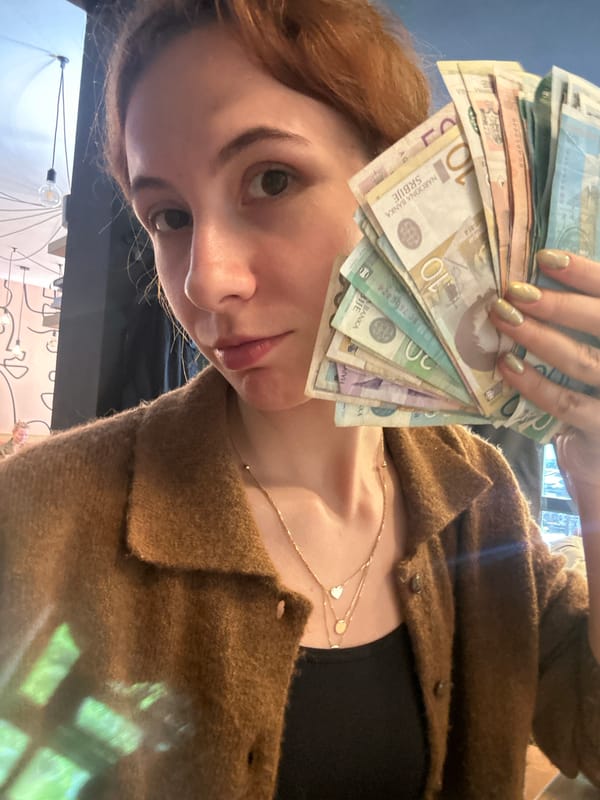 Woman displays cash, uses crypto app in Novi Sad