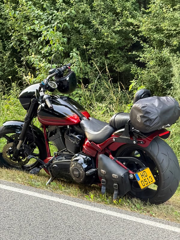 Several motorcycles parked roadside in Mensdorf, Luxembourg