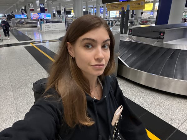 Woman takes selfie at Hong Kong International Airport