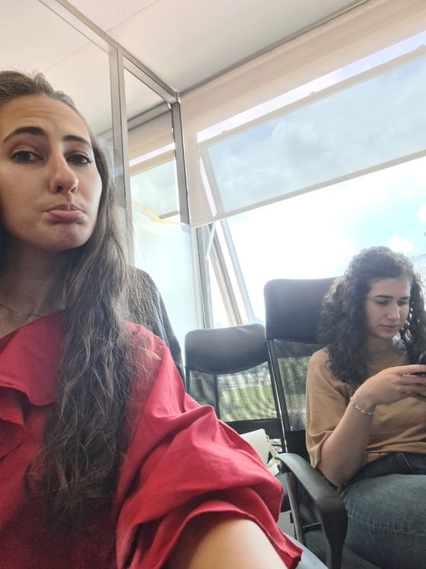Two women share snacks, photos during Sofia office gathering