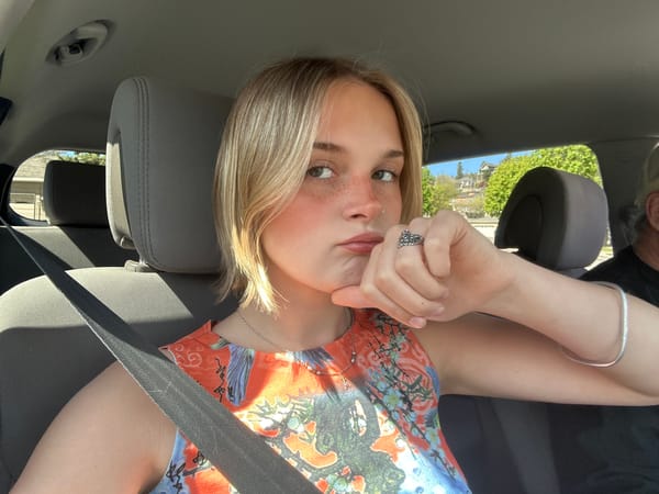 Woman takes selfie in passenger seat, Kelowna