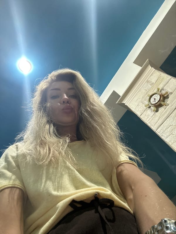 Woman documents afternoon at home with pets in Armavir