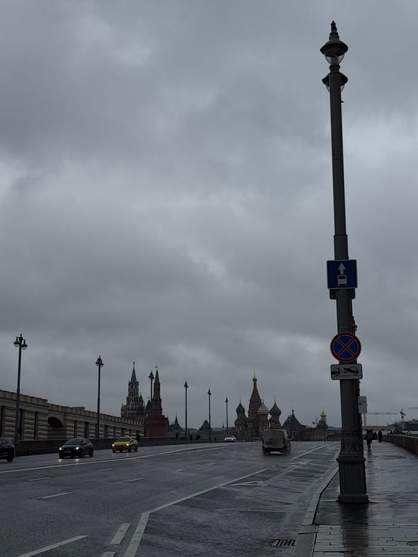 Couple records selfie video while walking Moscow sidewalk