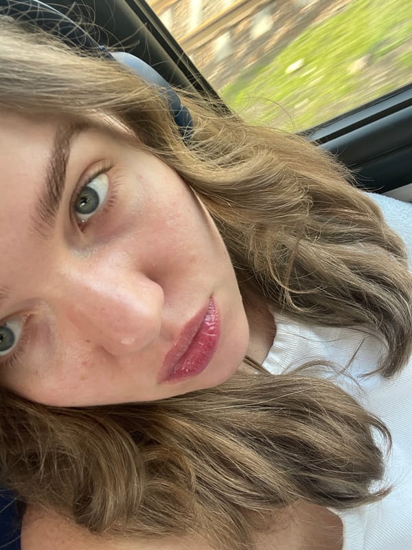 Woman takes selfie indoors in Moscow with nature backdrop