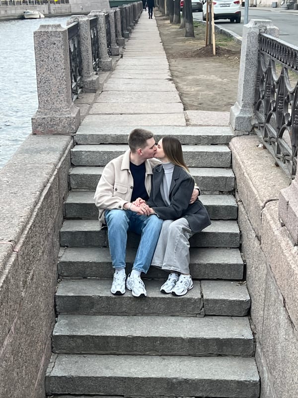 Couple shares romantic moment on Saint Petersburg staircase