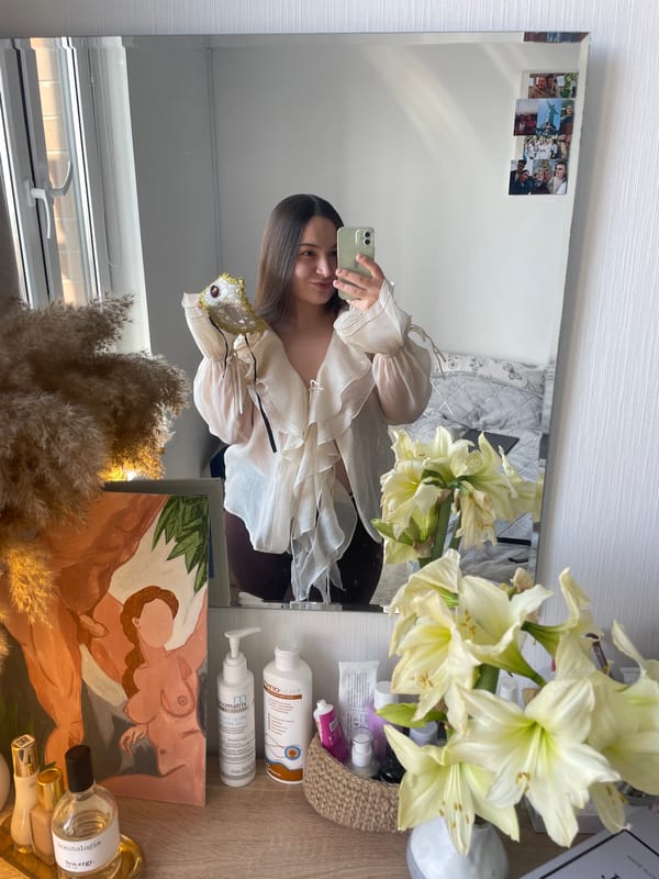 Woman takes mirror selfies with mask in Balashikha bedroom